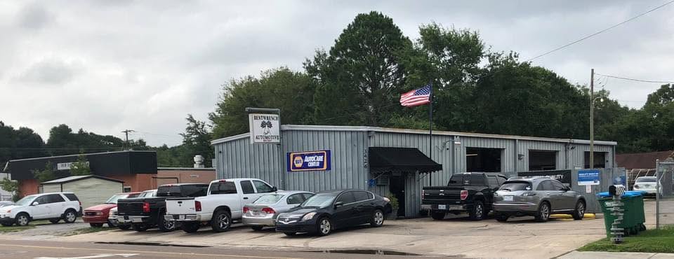 The Bentwrench Automotive shop on Old Mobile Avenue with the NAPA AutoCare sign and a full lot